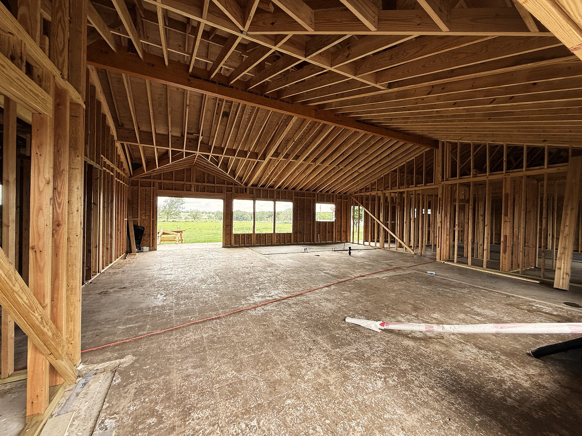 Inside the new build — framed and opening to the pasture