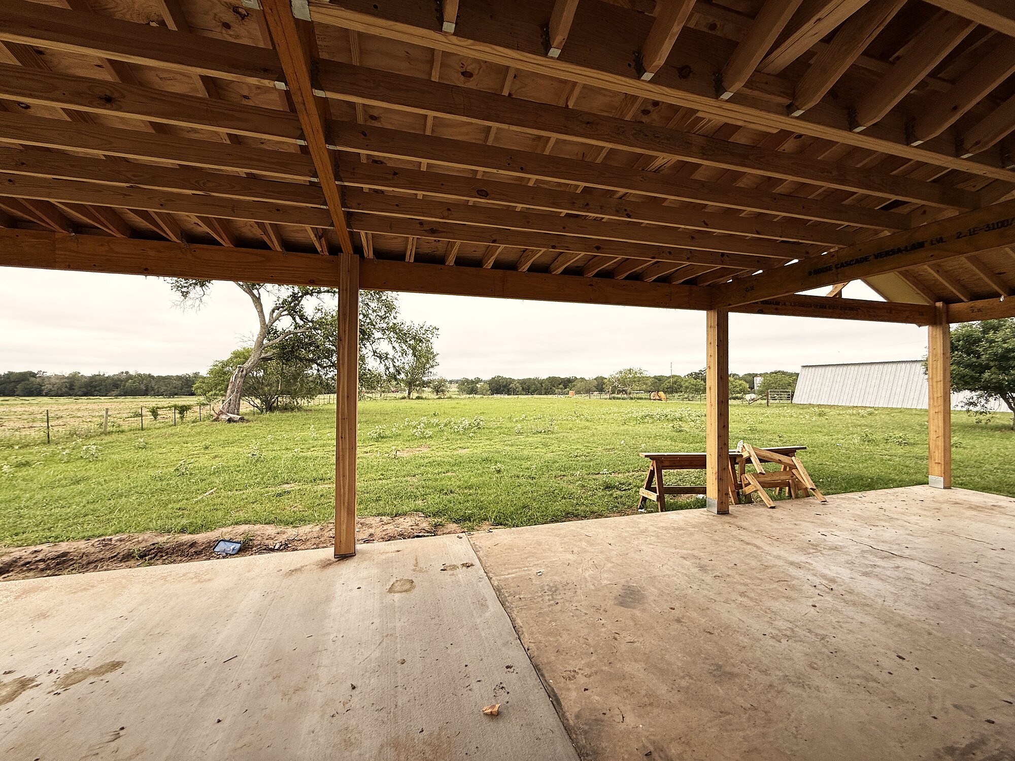 The covered porch looking out over the ranch pasture